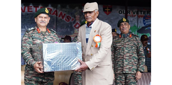 Northern Command chief Lt Gen Upendra Dwivedi honouring an ex-serviceman in Rajouri on Saturday.