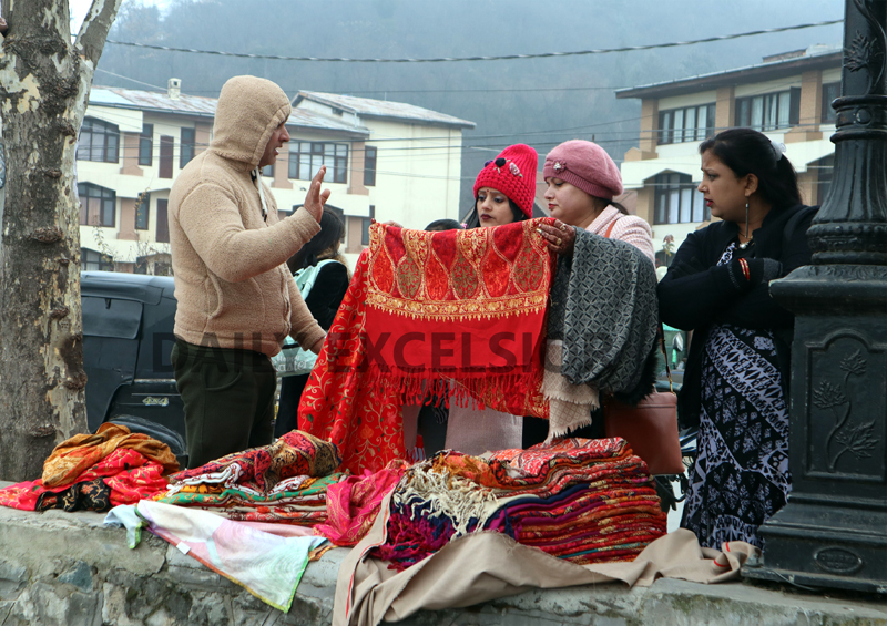 People purchase woolen clothes in Srinagar on Tuesday. -Excelsior