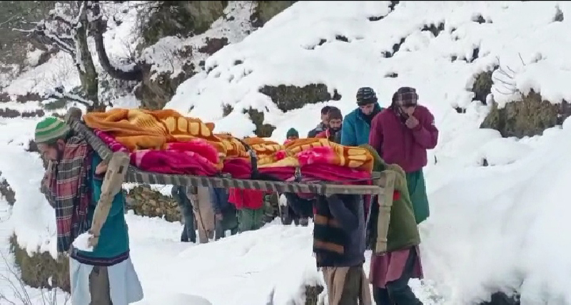 A pregnant woman being taken to hospital in snow-clad Bhallessa area of Doda on Saturday. — Excelsior/Tilak Raj