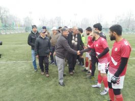 A police official interacting with players at TRC Srinagar.