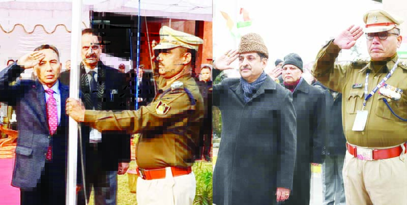 Acting CJ Justice Tashi Rabstan unfurling National Flag in Jammu wing of High Court (L) and Justice Vinod Chatterji Koul saluting Tricolor at Srinagar. (R).
