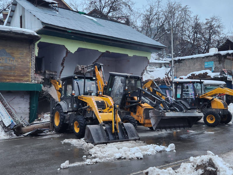 Commercial structure of former Social Welfare Minister Gh Hassan Khan on State land demolished by Revenue authorities in Shopian town. — Younis Khaliq