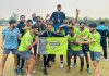 Players of Downtown Heroes celebrating induction of Hilal Parray as head coach in Srinagar on Monday.