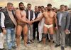 Wrestlers being introduced by dignitaries during Dangal in Akhnoor on Monday.