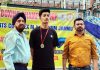 Winner of a bout posing with Dr Nirmolak Singh (president, J&K Amateur Boxing Association) after receiving medal.