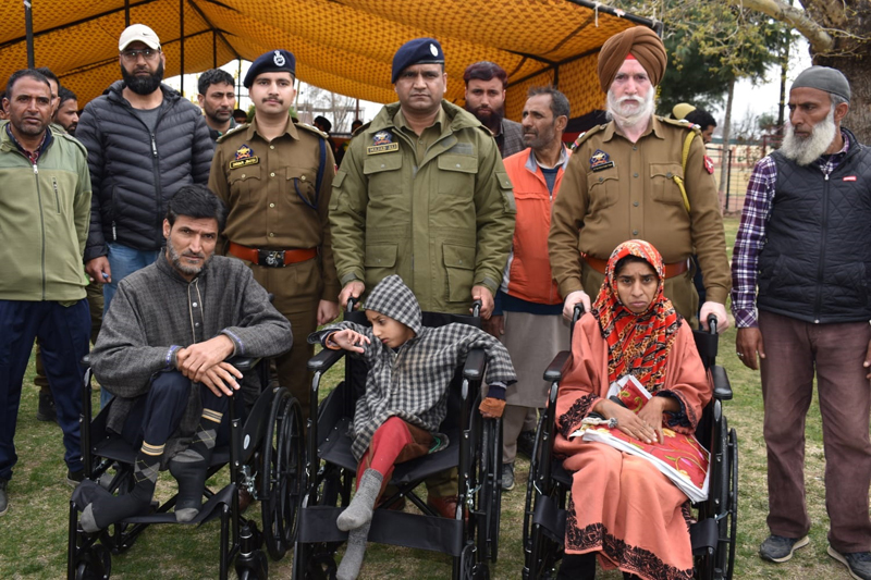 SSP Pulwama Mohd Yousuf posing with beneficiaries at Pulwama on Friday.