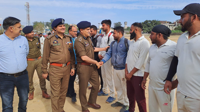 DIG Shakti Pathak interacting with players along with other officers at Samba on Friday.