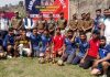 Winning team posing with trophy and senior officers of Rajouri Police.