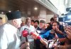 Sharad Pawar and Farooq Abdullah talking to mediapersons after meeting of all-party J&K delegation with opposition leaders at New Delhi on Thursday.