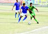 Players in action during a football match at Srinagar on Monday.