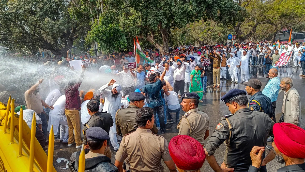 Police personnel use water cannons to disperse Punjab Congress supporters during 'Chalo Raj Bhawan' march, in Chandigarh