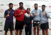 J&K fencing players displaying their medals.
