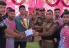 Trophy being presented to winners by Police Officials at Arnas in Reasi on Saturday.