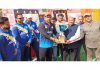 Trophy being presented to winners by NC provincial president Rattan Lal Gupta at Jagti on Wednesday.
