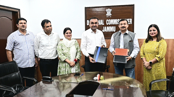 Chairman of SSKSB Ramesh Kumar displaying an MoU after signing at Jammu on Wednesday.