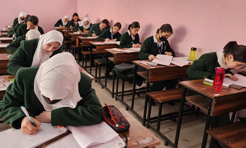 Students appearing in exam at Kothi Bagh Hr Secondary School in Srinagar on Monday. - Excelsior/Shakeel