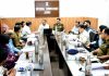 Div Com chairing a meeting at Jammu.