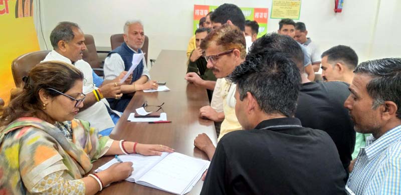 BJP senior leader and former Dy CM, Dr Nirmal Singh listening public grievances at Jammu on Monday.