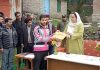 DDC Baramulla Dr Syed Sehrish Asgar handing over certificate to a beneficiary.
