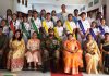 Students posing with dignitaries at APS Rakhmuthi on Saturday.