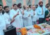 Tarachand along with other AICC leaders showing the victory signs as they canvass in Jalandhar West LS seat on Saturday.