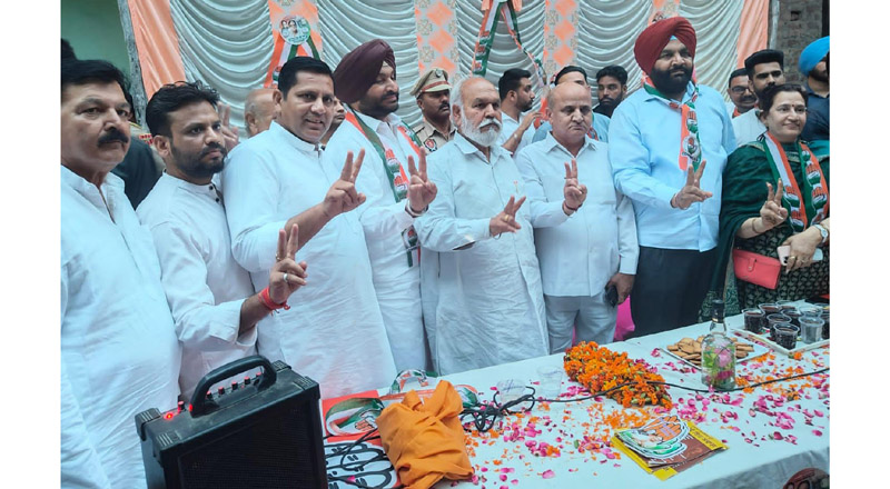 Tarachand along with other AICC leaders showing the victory signs as they canvass in Jalandhar West LS seat on Saturday.