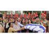 Ritu Singh, Guneet Monga Kapoor and others presenting National Flag of Commander T Sonam at Octroi Post in Suchetgarh on Sunday. -Excelsior/Rakesh