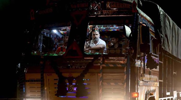 Congress leader Rahul Gandhi takes a ride in a truck while travelling from Delhi to Chandigarh on Tuesday. (UNI)