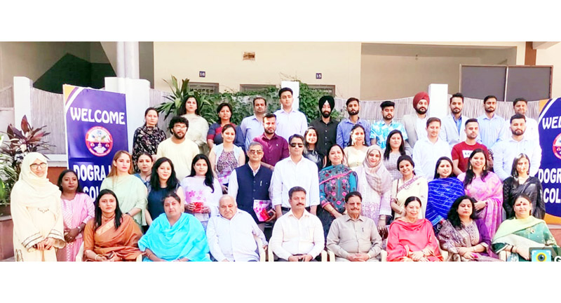 Staff and students of Dogra Law College pose for a group photograph during alumni meet.