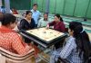 JU's employees posing a carrom during a sports meet at Jammu University on Tuesday.