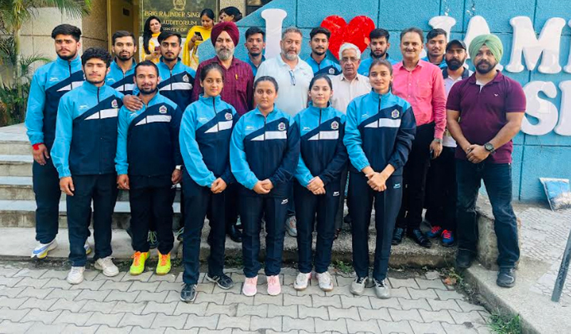 Men and women fencing teams of JU posing with their coaches and other officials before leaving to Lucknow.