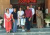 Little Avnit Malhotra of Jodhamal Public School display the International Book of Records Certificate and Prestigious Medal he won.