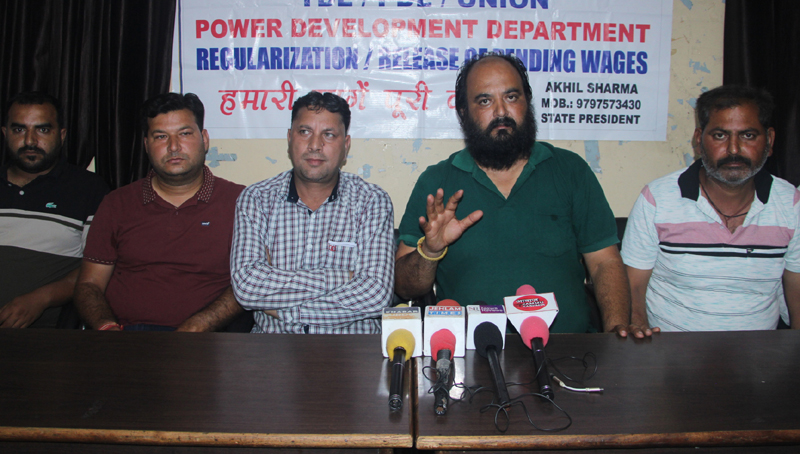 PDL/TDL and other PDD Workers Union president, Akhil Sharma, flanked by others addressing press conference in Jammu on Monday. — Excelsior/ Rakesh