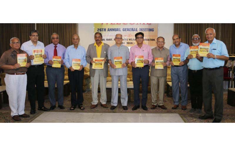 Members of CGPWA Jammu releasing a Pensioners' Journal during the 26th AGM on Saturday.