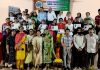 Dignitaries posing for a group photograph at book exhibition and cultural bonanza function organized at Commerce College.