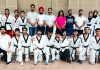Budding Taekwondo athletes pose with observer of JKSC and officials after selection trials in Jammu.