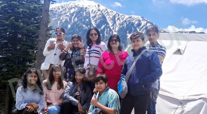 Tourists from Jaipur, Rajasthan posing for group photograph at Chhatargala in Bhaderwah on Tuesday. -Excelsior/Tilak Raj