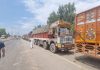 Trucks stranded on the National Highway at Qazigund for last 15 days. — Excelsior/Sajad Dar