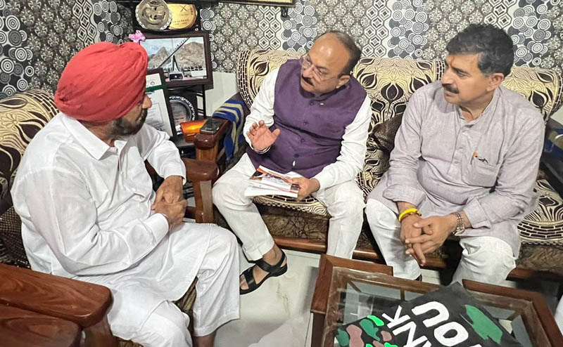 Ashish Sood and Jugal Kishore Sharma interacting with Captain Bana Singh at his residence in Jammu on Sunday.
