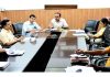 Divisional Commissioner chairing a meeting on Tuesday.