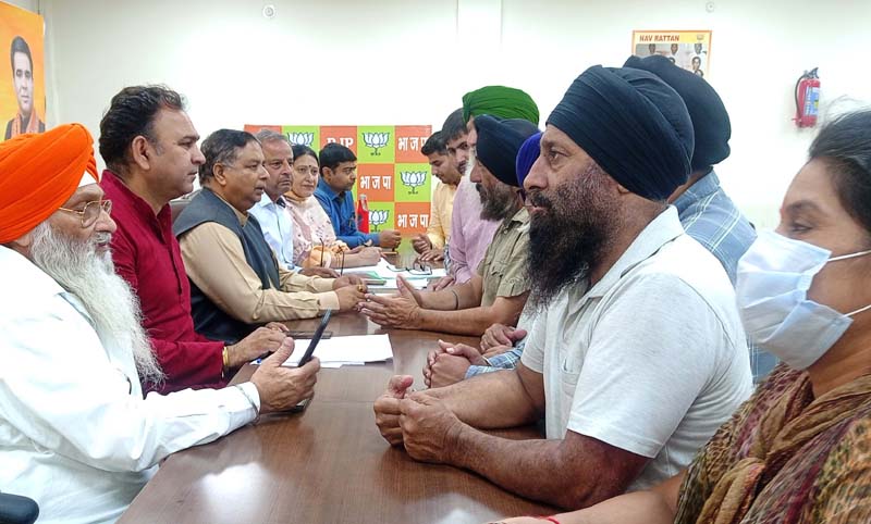 BJP leaders listening public grievances at party office Trikuta Nagar on Wednesday.