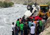 A vehicle which fell into river Shingo being brought out in Kargil on Saturday. Another pic on page 4. — Excelsior/Basharat Ladakhi