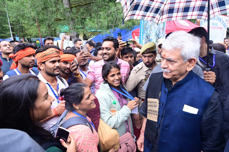 LG Manoj Sinha interacting with pilgrims at the base camp on Saturday.