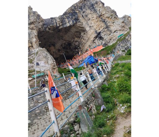 Yatris ascending the staircase at holy cave for darshan on Saturday.