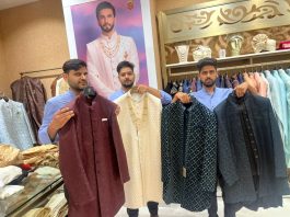 Manyavar's sales team displaying exclusive ethnic wear at their store in Wave Mall, Jammu on Tuesday.