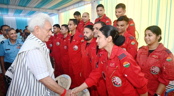 Lieutenant Governor Manoj Sinha interacting with Surya Kiran Team of Indian Air Force during the air show in Jammu Air Force Station on Friday. - Excelsior/Rakesh