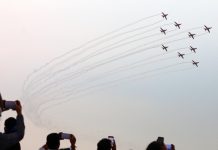 People try to capture a view of air show in Jammu on Friday. - Excelsior/Rakesh