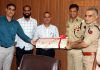 ADGP Jammu, Mukesh Singh, and DIG JSK Range, Shakti Pathak, presenting a retirement gift to SO to ADGP Jammu, Ashok Kumar, on Monday.
