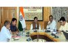 Div com Kashmir reviewing functioning of corporations & departments.