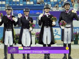 Indian Dressage Team posing with Gold Medal.